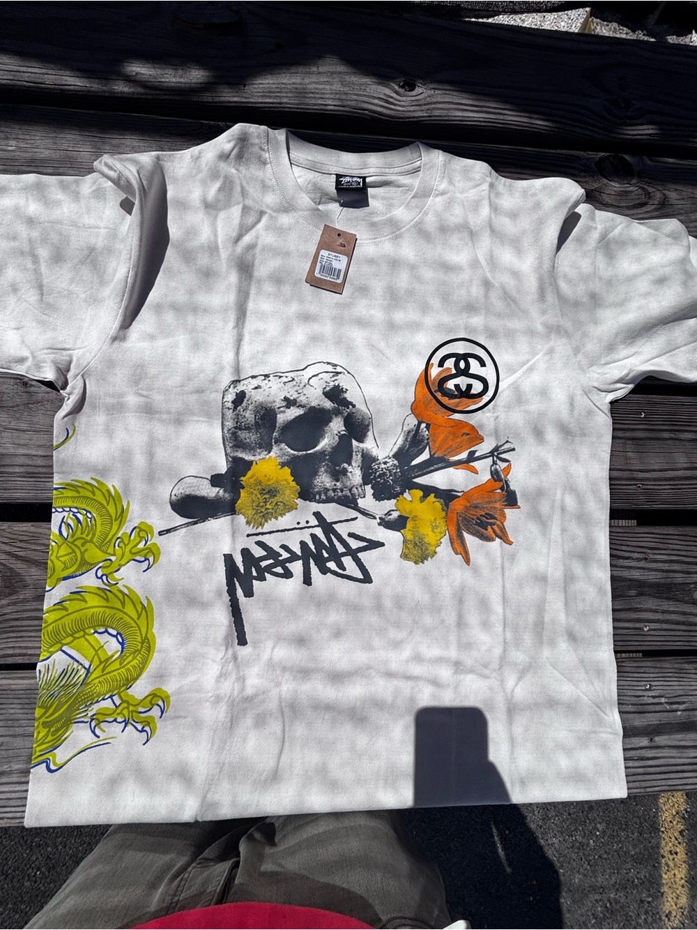 Stussy White Graphic Skull Tee with Orange & Yellow Accents